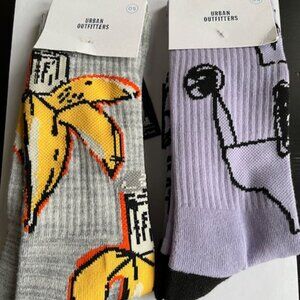 Urban Outfitters pair of socks with artwork by Jean Michel Basquiat.